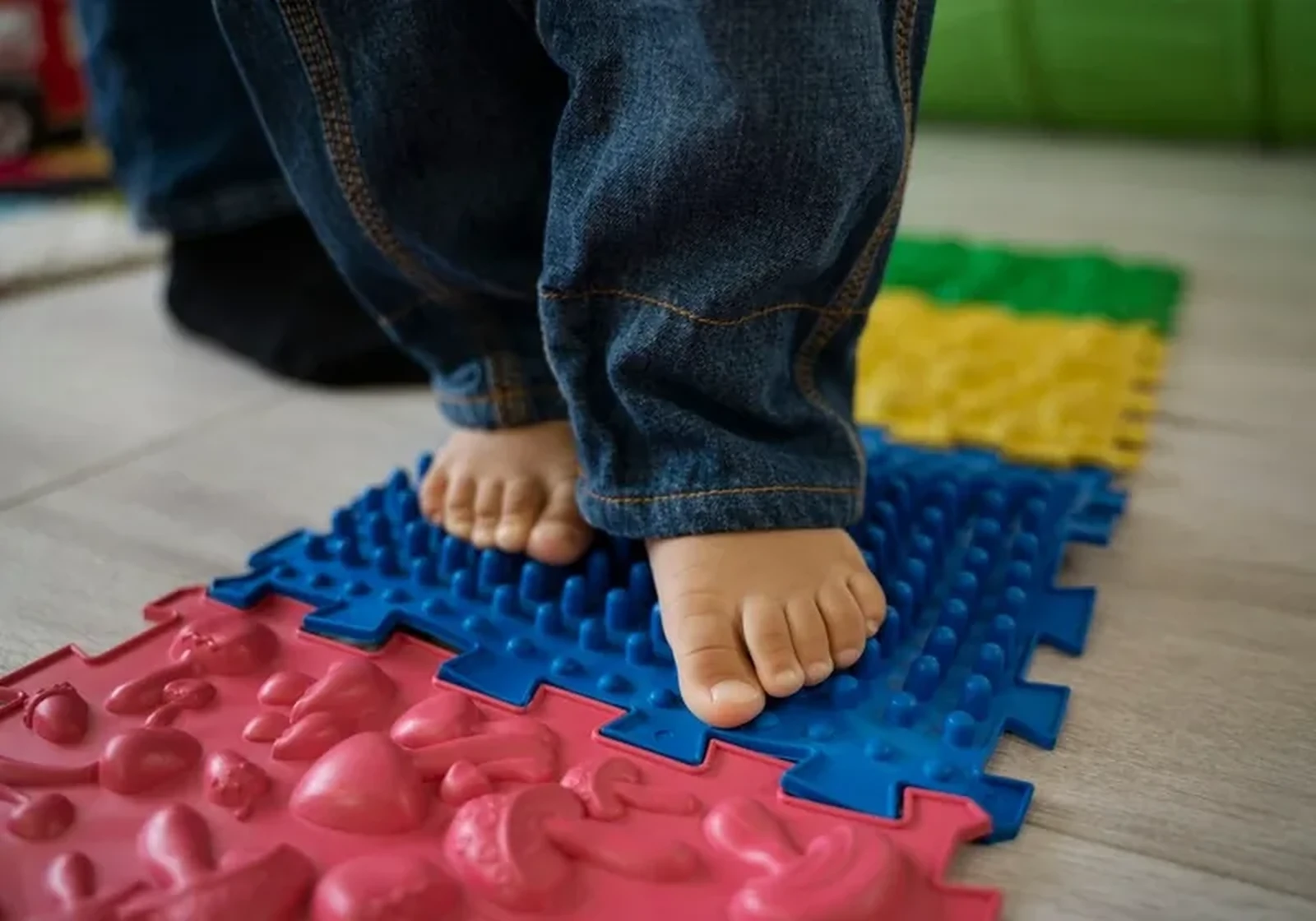 A child using sensory equipment during a therapy session